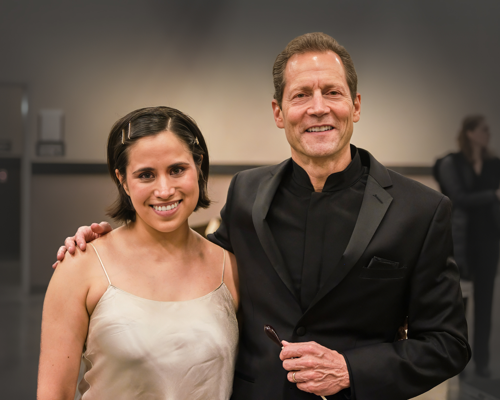 Man and woman standing with arms around each other