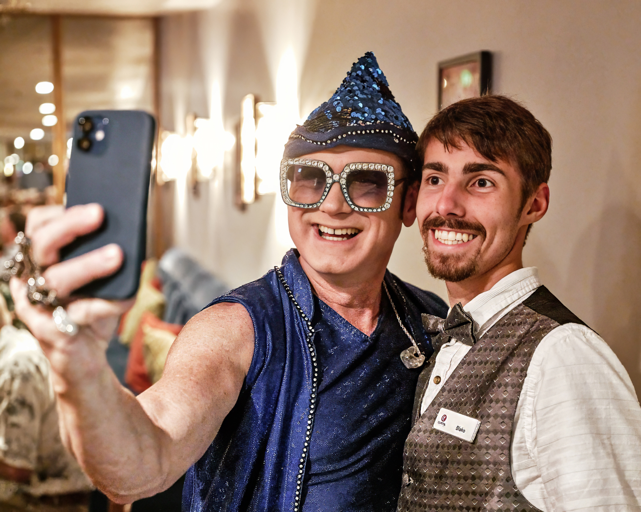 Performer taking a selfie with volunteer